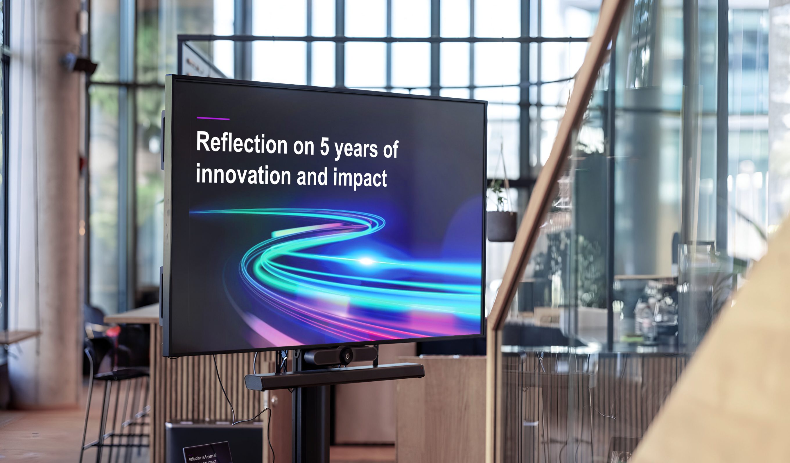 AECO reflection on 5 years of innovation slide on a TV display