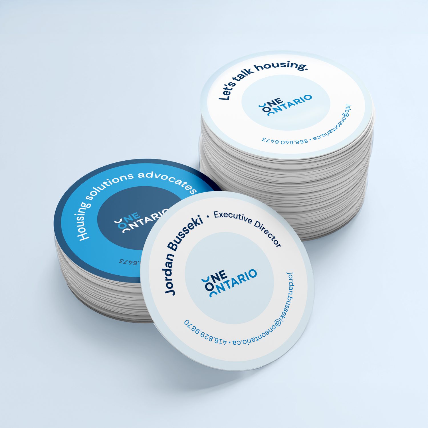 Stacks of One Ontario circular business cards